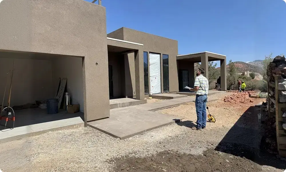 On-site walkthrough during custom home construction budgeting phase in Arizona