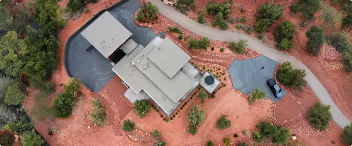 Aerial view of custom luxury home surrounded by Arizona desert landscape